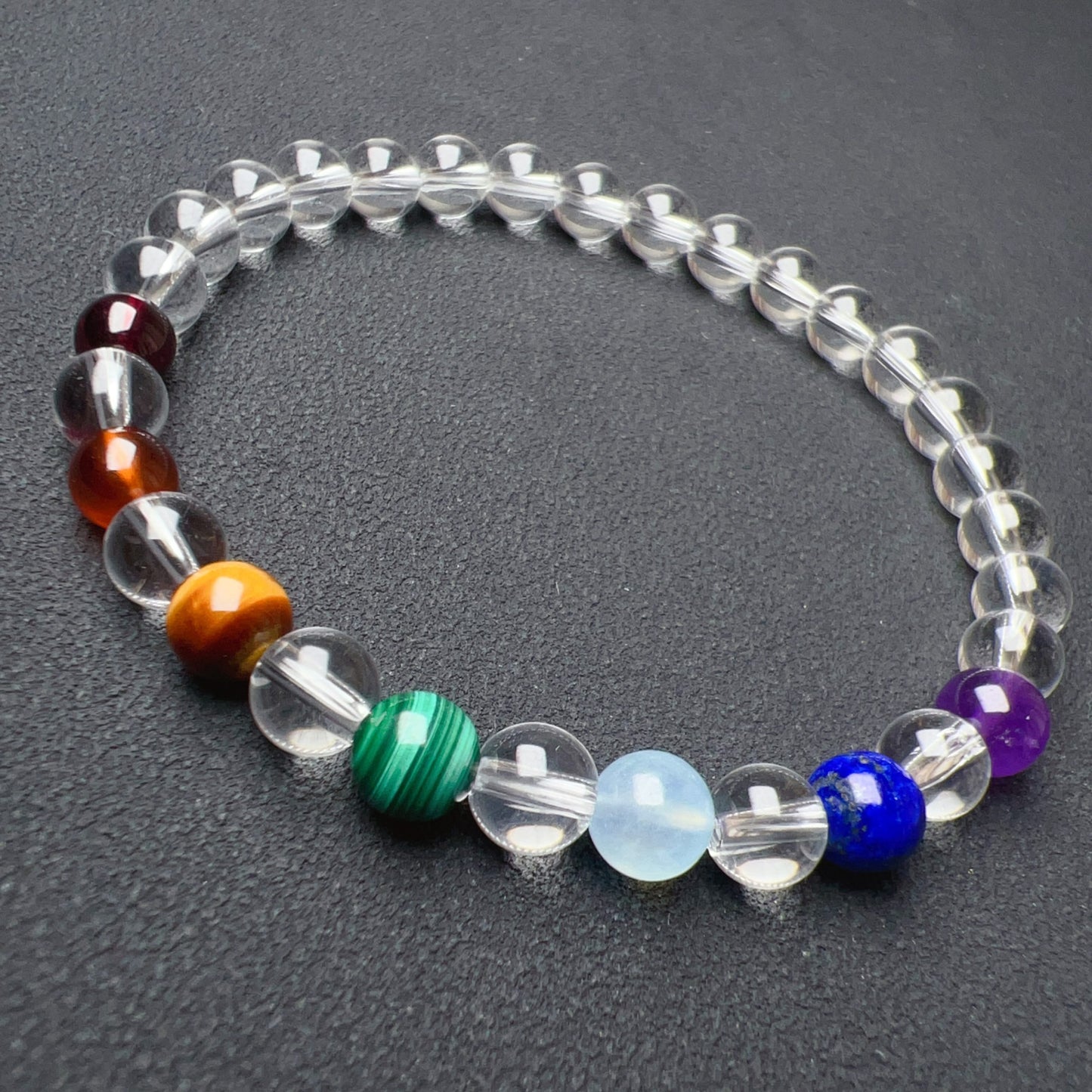 Handmade Seven Chakra Bracelet | Natural Healing Crystals: Clear Quartz, Amethyst, Lapis Lazuli, Aquamarine, Malachite, Brown Tiger Eye, Garnet