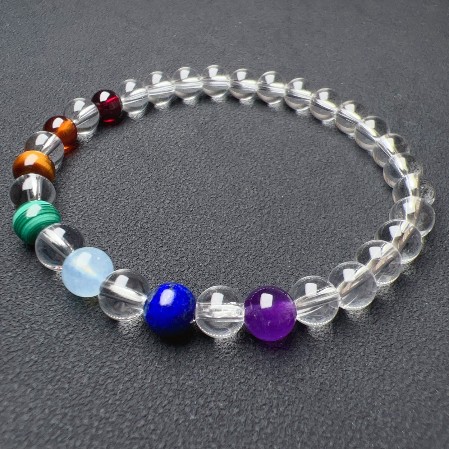 Handmade Seven Chakra Bracelet | Natural Healing Crystals: Clear Quartz, Amethyst, Lapis Lazuli, Aquamarine, Malachite, Brown Tiger Eye, Garnet